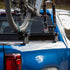 Blue truck with a bicycle mounted on a roof rack