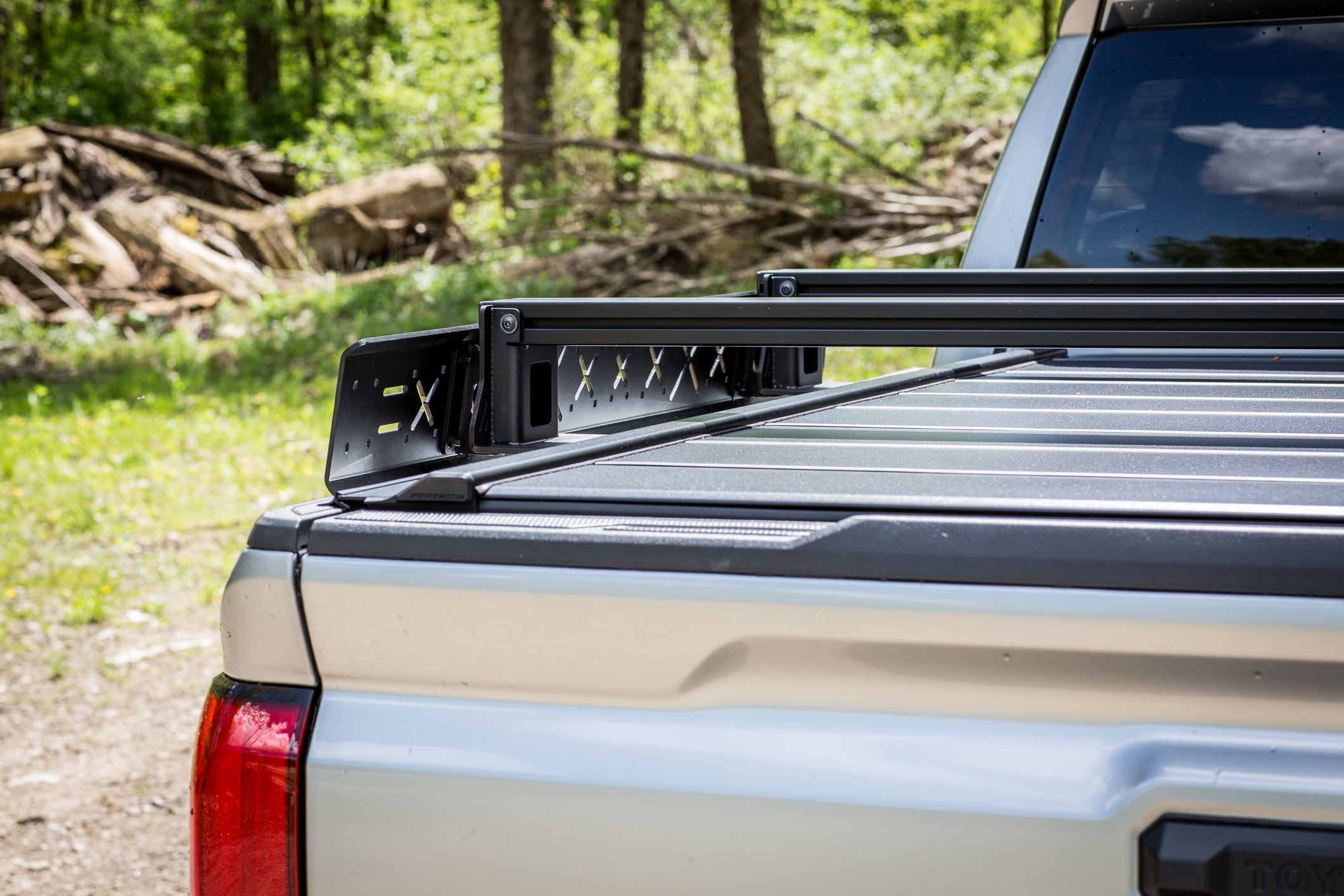 Truck bed with a roof rack in a natural setting
