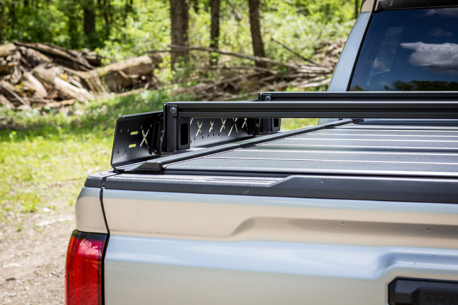 Truck bed with a roof rack in a natural setting
